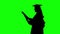 Graduate of dancing after the ceremony of awarding the diploma. Silhouette. Green screen