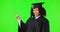 Graduate, green screen and woman pointing, face and presentation isolated on studio background information. African