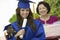 Graduate Holding Teddy Bear And Diploma Outside