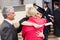 Graduate hugging mother