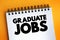 Graduate Jobs text on notepad, concept background