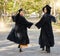 Graduate portrait, holding hands and happy friends celebrate learning success, education goals or university graduation