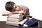 Graduate sleeping on books