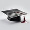 Graduate student\\\'s hat on white background close up