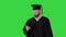 Graduate student texting on the phone on a Green Screen, Chroma Key.