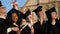 Graduate students taking selfie after the graduation.