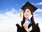 Graduate woman Holding Degree with cloud background