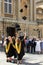 Graduates celebrating near the Roman Baths, Bath, England