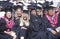 Graduates march across the stadium field