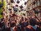 Graduates toss their hats in the air