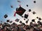 Graduates toss their hats in the air