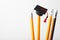 Graduation cap on pencils. Education, study and learn concept