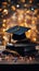 A graduation cap rests beside books, celebrating academic achievement amid confetti