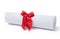 Graduation diploma scroll tied with red ribbon