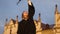 Graduation - girl throws her hat in the air and smiles to camera