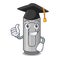 Graduation gray crayon above character wooden table