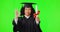 Graduation, green screen and woman okay hands isolated on studio background for education, college or success emoji