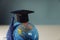 Graduation hat on globe model close-up. Education and scholarships concept