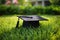 Graduation hat on green grass in the garden. Education concept, graduation hat lies on green grass, AI Generated