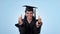 Graduation success, thumbs up or excited student in studio with education, college or university goal. Woman, hand sign