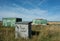 Graffiti on blockwork structure on derelict land