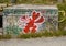 Graffiti on a cement block along the road near La Turbie, French Riviera