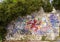 Graffiti covered stone wall along trail from La Turbie to Tete de Chien, southeastern France.