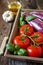 Graffiti eggplants, tomatoes in tray, garlic and olive oil