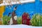 Graffiti with image of cartoon characters bear Winnie Pooh and donkey Ia on concrete fence in city yard, Gomel, Belarus