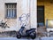 Graffiti on Old Stucco Building and Motor Scooter