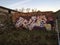 Graffiti wall in the farm house with blue skies