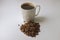Grain black coffee in a white mug on a white background