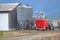 Grain Carrier and Loading Bins on Farm