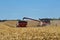 Grain cart being loaded from a combine harvester in  northern Illinois