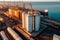 Grain deal concept, metal grain storage stands close up to sea port