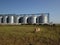 Grain elevator. Metal grain elevator in agricultural zone. Agriculture storage for harvest. Grain elevators on green