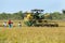 A grain harvester is moved into position to begin reaping a field of rice near Panama in Sri Lanka.