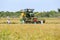 A grain harvester is moved into position to begin reaping a field of rice near Panama in Sri Lanka.