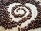 Grain roasted coffee laid out in a spiral, heart.