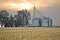 Grain silos and cropped wheat field