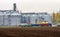 Grain trucks in front of the grain warehouse.