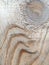 Grained wood texture with curves and grooves like sand