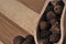 Grains allspice on a wooden board.