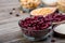 Grains Red bean in bowl or spoon wood background. Red bean or kidney beans in bowl.