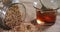 Grains spilling out of jar with bowl of honey 4k