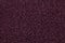 Grainy dark purple background with spotted pattern. Texture backdrop