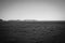 Grainy old style effect image typically dry flat landscape
