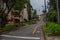 GRAMADO, BRAZIL - MAY 06, 2016: nice irregular street with a lot of plants and trees in the sidewalks