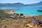 Gramvousa island, Greece - June 25, 2015: A crowd of tourists at the foot of the ancient fortress