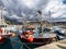 Gran Canaria, Spain - Feb 21, 2023: Colorful canarian fishing boats at the harbor in Puerto de Mogan, Gran Canaria,Spain